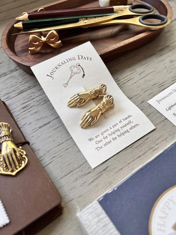 The Brass Hand Paper Clip
